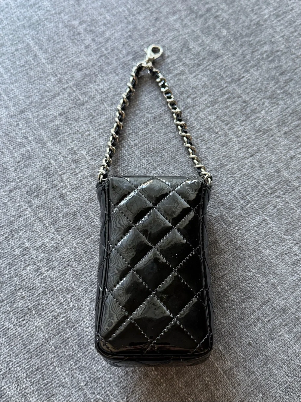 CHANEL Black Patent Leather Quilted Phone Case with Silver Hardware